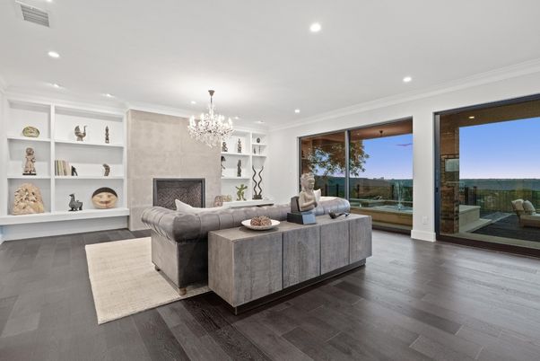 Chandelier, Fireplace, Interior, Living room, Recessed Lighting, Water, Wood Texture Flooring
