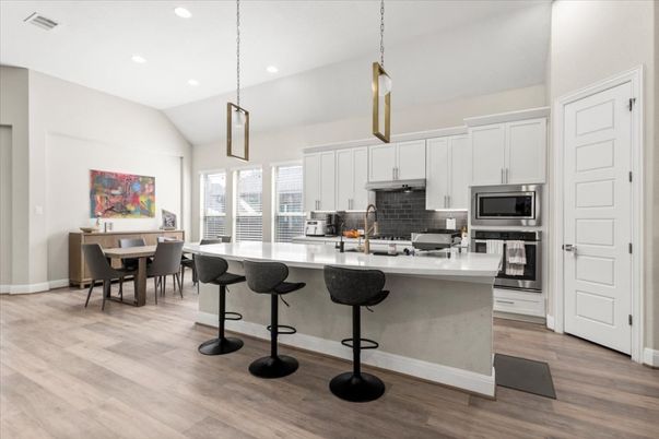 Dining room, Interior, Kitchen, Pendant Lights, Recessed Lighting, Stainless Steel Appliances, Wood Texture Flooring