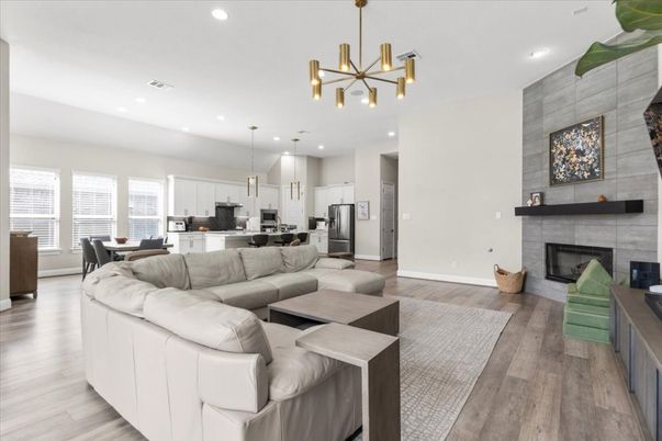 Dining room, Fireplace, Interior, Kitchen, Living room, Pendant Lights, Recessed Lighting, Stainless Steel Appliances, Wood Texture Flooring