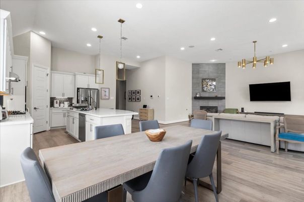 Fireplace, Interior, Kitchen, Living room, Pendant Lights, Recessed Lighting, Stainless Steel Appliances, Wood Texture Flooring