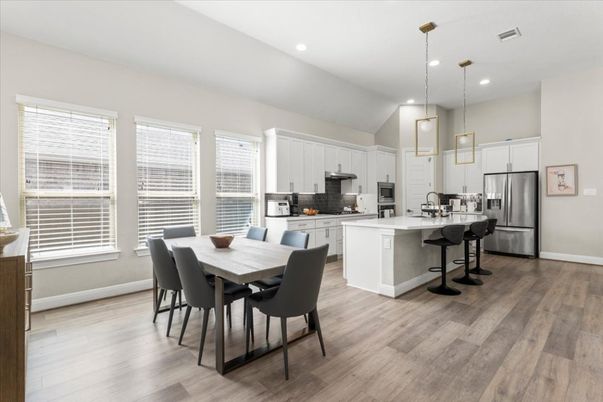 Dining room, Interior, Kitchen, Pendant Lights, Recessed Lighting, Stainless Steel Appliances, Wood Texture Flooring