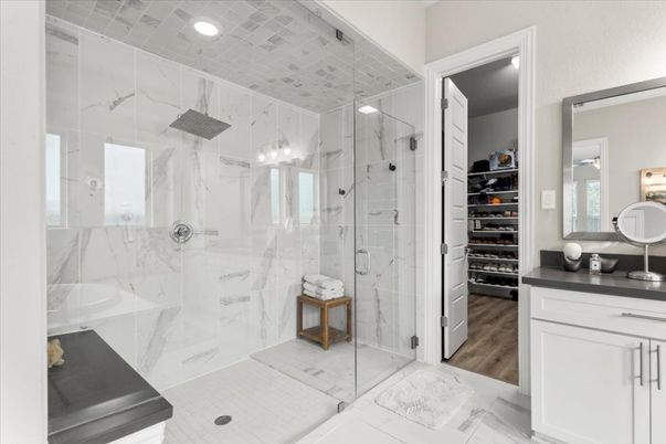 Bathroom, Glass Shower, Interior, Marble Walls, Recessed Lighting, Walk-in Closets, Wood Texture Flooring