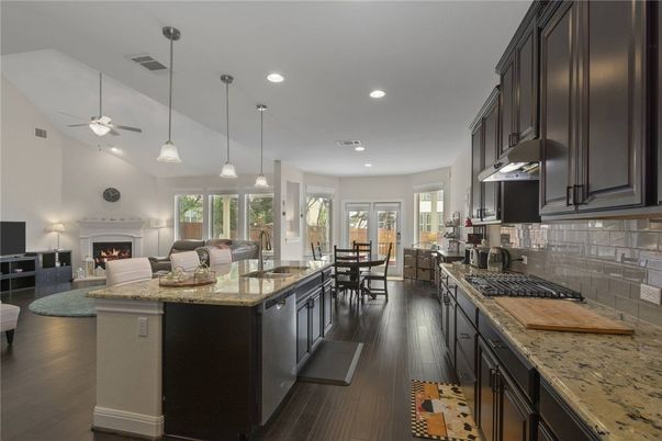 Dining room, Fireplace, Interior, Kitchen, Living room, Pendant Lights, Recessed Lighting, Wood Texture Flooring