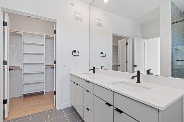 Bathroom, Dual Sink Vanities, Interior, Recessed Lighting, Walk-in Closets, Wood Texture Flooring
