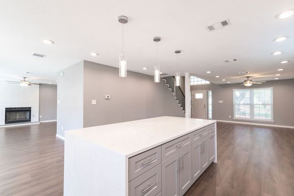 Empty room, Fireplace, Interior, Kitchen, Pendant Lights, Recessed Lighting, Wood Texture Flooring