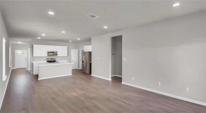 Empty room, Interior, Kitchen, Recessed Lighting, Stainless Steel Appliances, Wood Texture Flooring