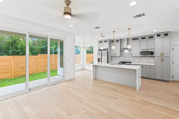 Interior, Kitchen, Pendant Lights, Recessed Lighting, Stainless Steel Appliances, Wood Texture Flooring