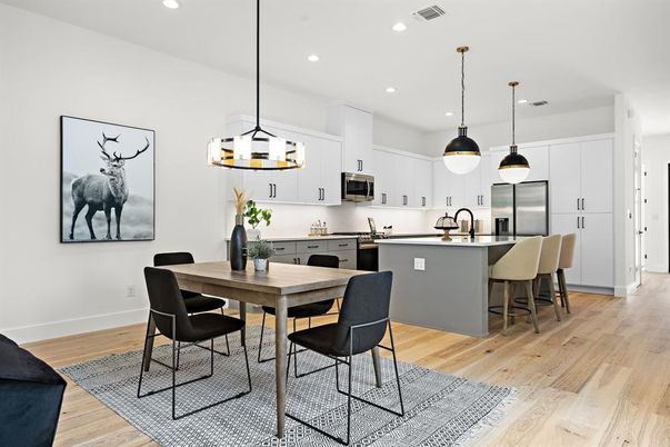 Dining room, Interior, Kitchen, Pendant Lights, Recessed Lighting, Stainless Steel Appliances, Wood Texture Flooring