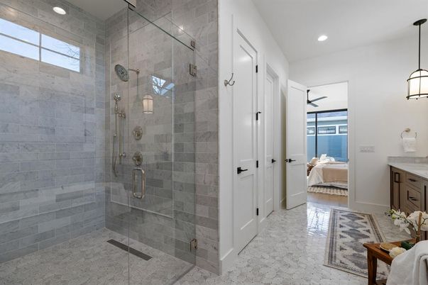 Bathroom, Bedroom, Glass Shower, Interior, Pendant Lights, Recessed Lighting, Stone Walls, Water