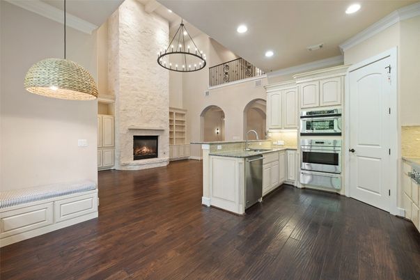 Fireplace, Interior, Kitchen, Pendant Lights, Recessed Lighting, Stainless Steel Appliances, Wood Texture Flooring