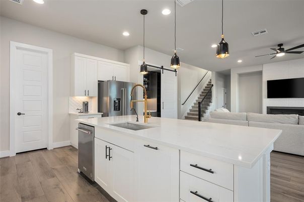 Fireplace, Interior, Kitchen, Pendant Lights, Recessed Lighting, Stainless Steel Appliances, Wood Texture Flooring