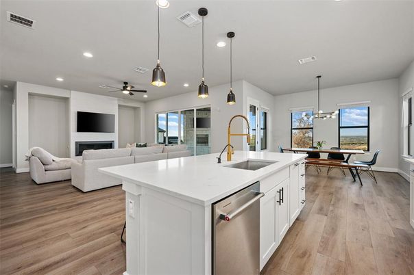 Dining room, Fireplace, Interior, Kitchen, Living room, Pendant Lights, Recessed Lighting, Stainless Steel Appliances, Wood Texture Flooring