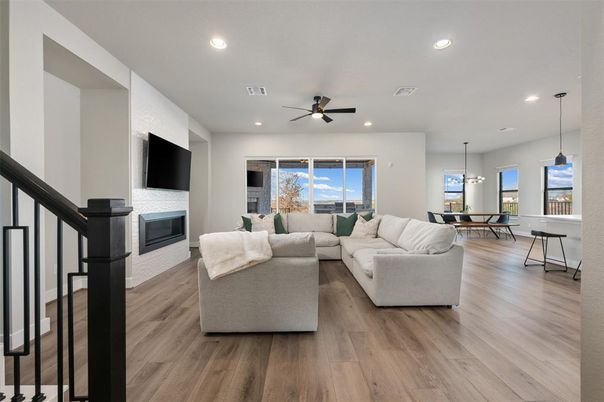 Dining room, Fireplace, Interior, Living room, Pendant Lights, Recessed Lighting, Wood Texture Flooring