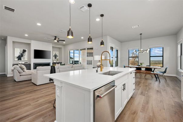 Dining room, Fireplace, Interior, Kitchen, Living room, Pendant Lights, Recessed Lighting, Stainless Steel Appliances, Wood Texture Flooring