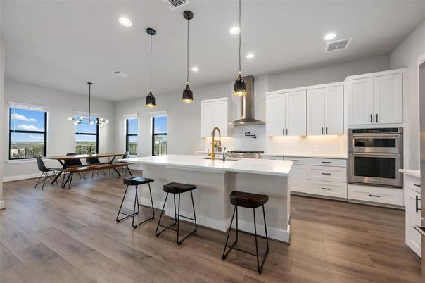 Dining room, Interior, Kitchen, Pendant Lights, Recessed Lighting, Stainless Steel Appliances, Wood Texture Flooring