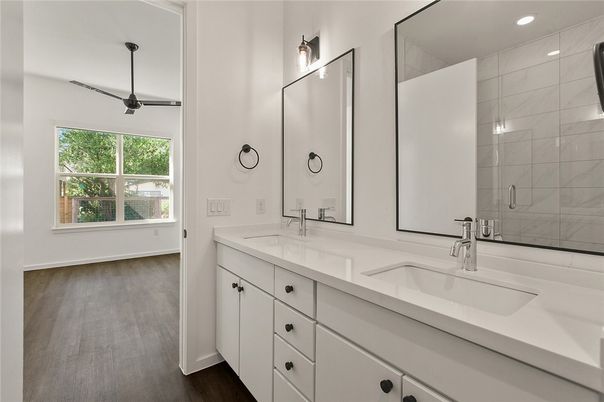 Bathroom, Dual Sink Vanities, Glass Shower, Interior, Recessed Lighting, Wood Texture Flooring