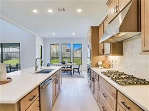 Dining room, Interior, Kitchen, Recessed Lighting, Stainless Steel Appliances, Wood Texture Flooring