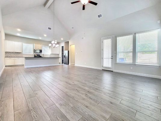 Chandelier, Empty room, Interior, Kitchen, Pendant Lights, Recessed Lighting, Stainless Steel Appliances, Wood Texture Flooring