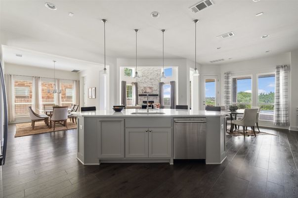 Dining room, Fireplace, Interior, Kitchen, Pendant Lights, Recessed Lighting, Stainless Steel Appliances, Wood Texture Flooring