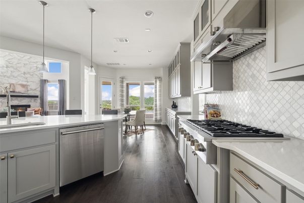 Dining room, Fireplace, Interior, Kitchen, Pendant Lights, Recessed Lighting, Stainless Steel Appliances, Wood Texture Flooring