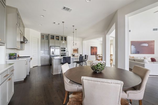 Dining room, Interior, Kitchen, Pendant Lights, Recessed Lighting, Stainless Steel Appliances, Wood Texture Flooring