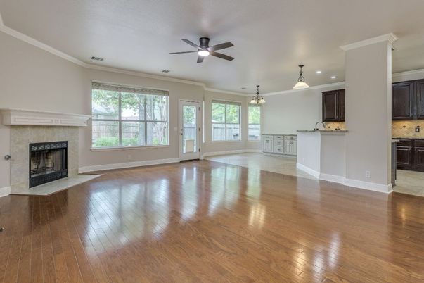 Empty room, Fireplace, Interior, Kitchen, Pendant Lights, Recessed Lighting, Wood Texture Flooring