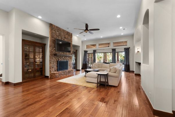Fireplace, Interior, Living room, Recessed Lighting, Stone Walls, Wood Texture Flooring