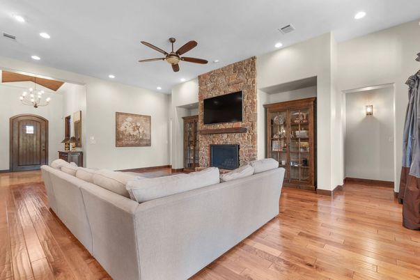 Fireplace, Interior, Living room, Recessed Lighting, Stone Walls, Wood Texture Flooring