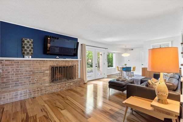 Dining room, Fireplace, Interior, Living room, Pendant Lights, Stone Walls, Wood Texture Flooring
