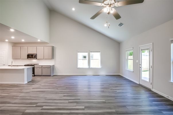 Empty room, Interior, Kitchen, Recessed Lighting, Stainless Steel Appliances, Wood Texture Flooring