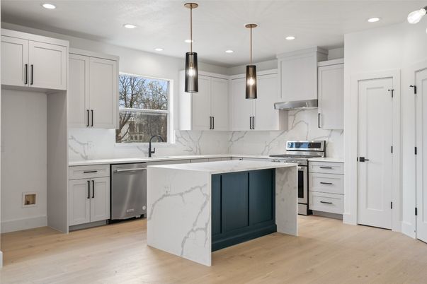 Interior, Kitchen, Marble Walls, Pendant Lights, Recessed Lighting, Stainless Steel Appliances, Wood Texture Flooring