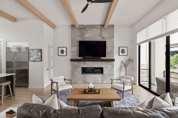 Fireplace, Interior, Living room, Recessed Lighting, Stainless Steel Appliances, Stone Walls, Wooden Beams, Wood Texture Flooring