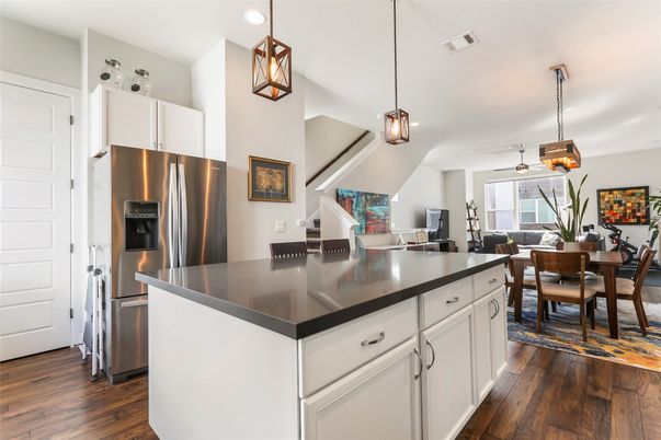 Dining room, Interior, Kitchen, Pendant Lights, Recessed Lighting, Stainless Steel Appliances, Wood Texture Flooring