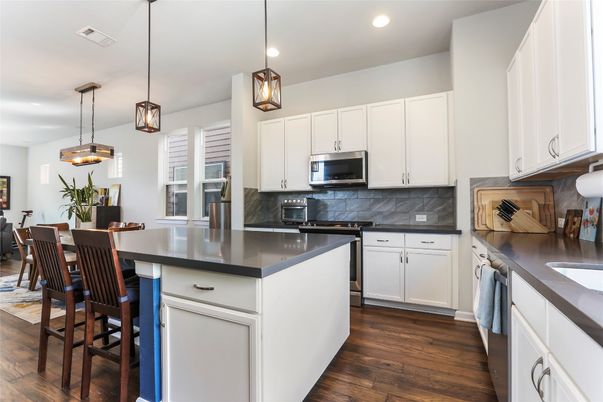 Dining room, Interior, Kitchen, Pendant Lights, Recessed Lighting, Stainless Steel Appliances, Wood Texture Flooring