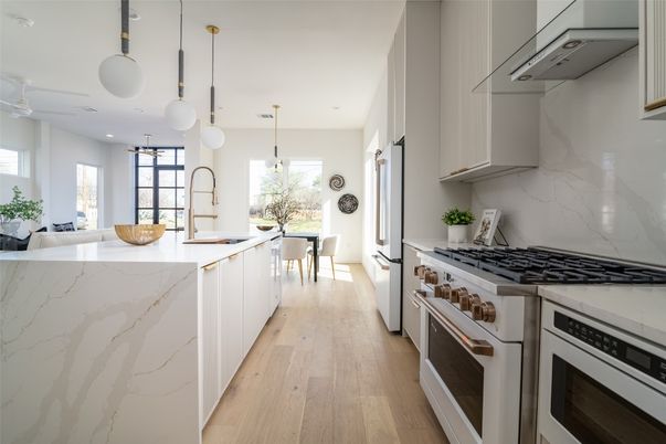 Interior, Kitchen, Marble Walls, Pendant Lights, Recessed Lighting, Stainless Steel Appliances, Wood Texture Flooring