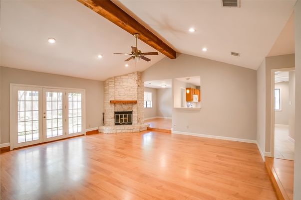 Empty room, Fireplace, Interior, Pendant Lights, Recessed Lighting, Stone Walls, Wooden Beams, Wood Texture Flooring