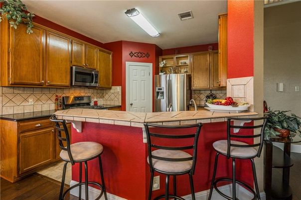Interior, Kitchen, Stainless Steel Appliances, Tile Countertops, Wood Texture Flooring