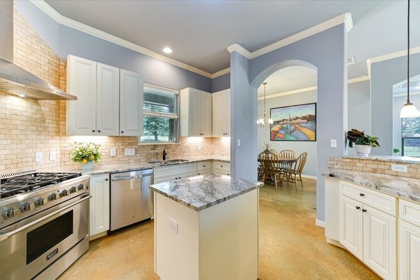 Chandelier, Dining room, Interior, Kitchen, Pendant Lights, Recessed Lighting, Stainless Steel Appliances, Stone Walls