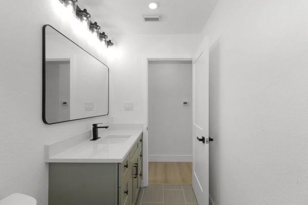 Bathroom, Dual Sink Vanities, Interior, Recessed Lighting, Wood Texture Flooring