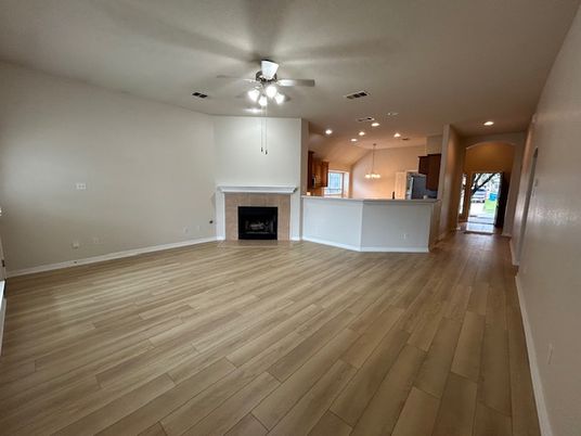 Empty room, Fireplace, Interior, Kitchen, Pendant Lights, Recessed Lighting, Wood Texture Flooring