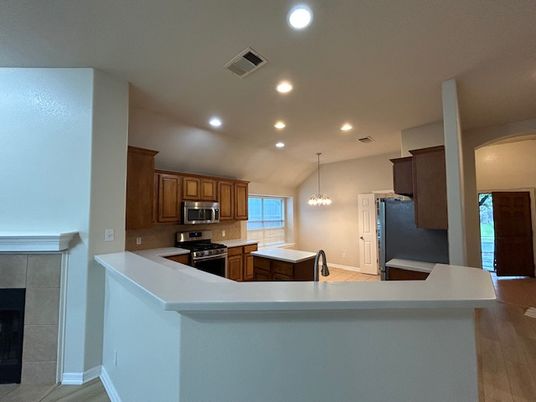 Chandelier, Interior, Kitchen, Pendant Lights, Recessed Lighting, Stainless Steel Appliances, Wood Texture Flooring
