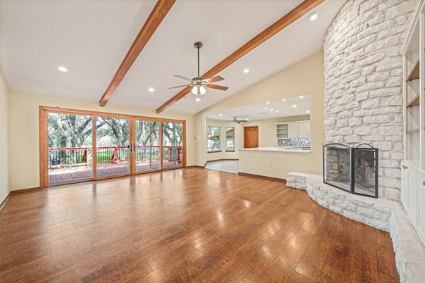 Empty room, Fireplace, Interior, Recessed Lighting, Stone Walls, Wooden Beams, Wood Texture Flooring