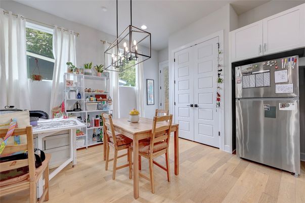 Dining room, Interior, Kitchen, Pendant Lights, Recessed Lighting, Stainless Steel Appliances, Wood Texture Flooring