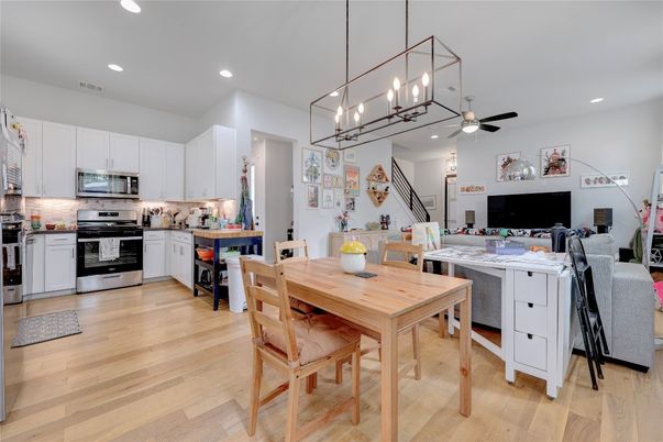 Chandelier, Dining room, Interior, Kitchen, Pendant Lights, Recessed Lighting, Stainless Steel Appliances, Wood Texture Flooring