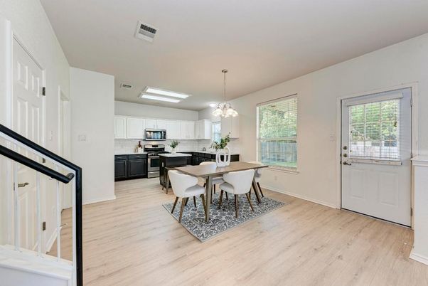 Chandelier, Dining room, Interior, Kitchen, Pendant Lights, Stainless Steel Appliances, Wood Texture Flooring