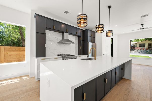 Interior, Kitchen, Marble Walls, Pendant Lights, Recessed Lighting, Stainless Steel Appliances, Wood Texture Flooring