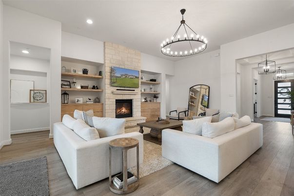 Fireplace, Interior, Living room, Pendant Lights, Recessed Lighting, Stone Walls, Wood Texture Flooring
