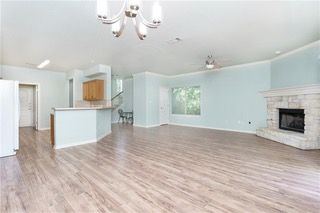Chandelier, Empty room, Fireplace, Interior, Kitchen, Recessed Lighting, Wood Texture Flooring