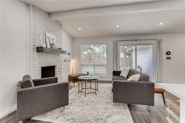 Fireplace, Interior, Living room, Recessed Lighting, Stone Walls, Wood Texture Flooring