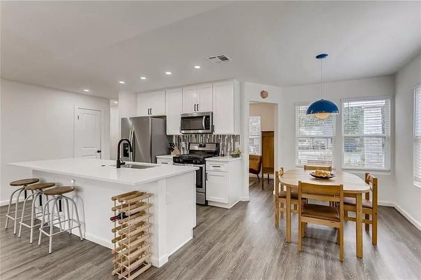 Dining room, Interior, Kitchen, Pendant Lights, Recessed Lighting, Stainless Steel Appliances, Wood Texture Flooring